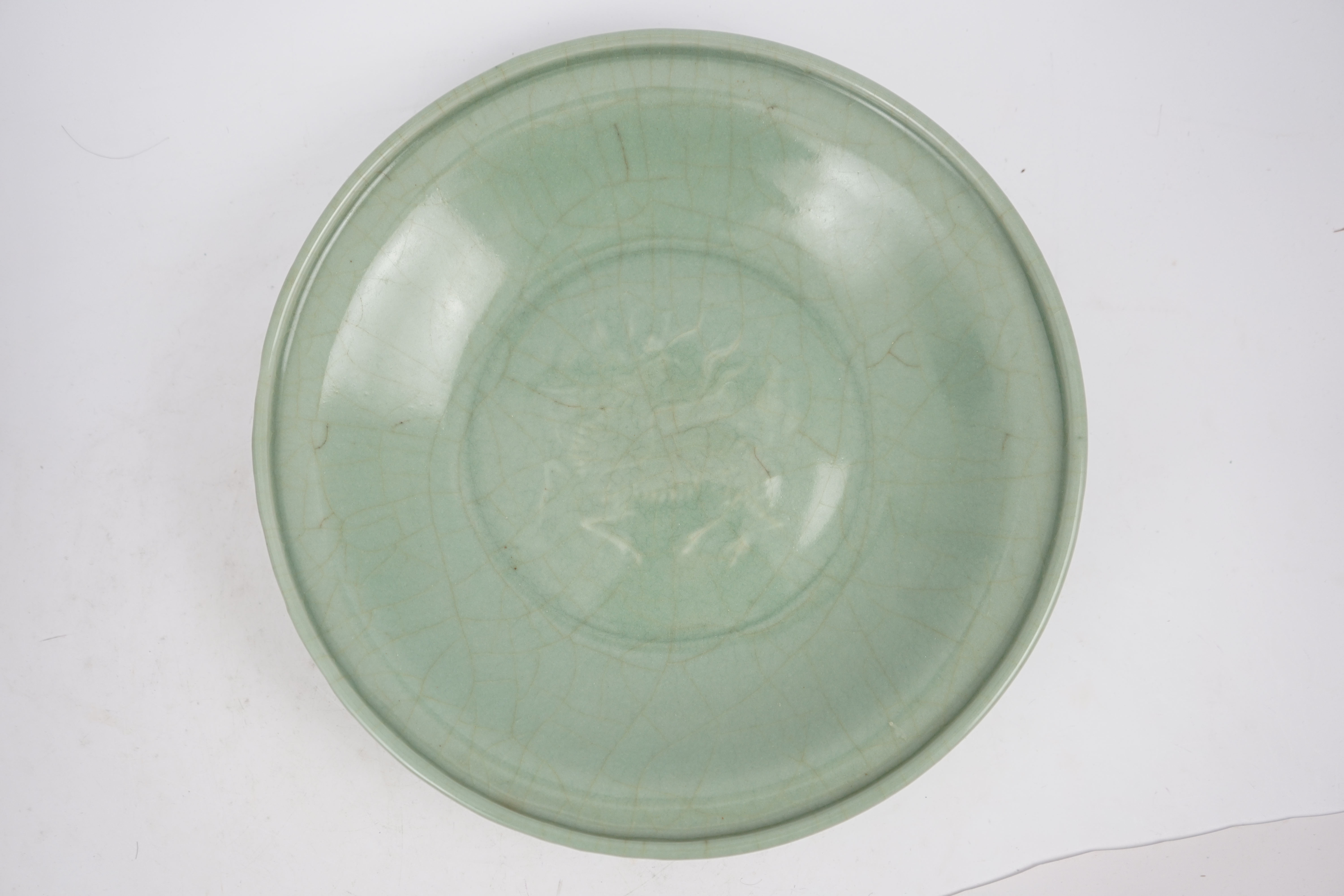 A Chinese Longquan celadon 'qilin' dish, 15th/16th century